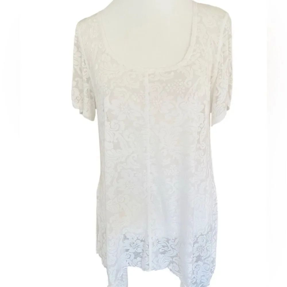 SNOSKINS white burn out style sharkbite hem short sleeved top size L.